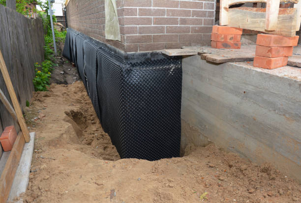 Happy homeowners after waterproofing job in Northwood